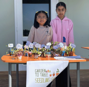 School kids selling seedlings at Garden to Table programme