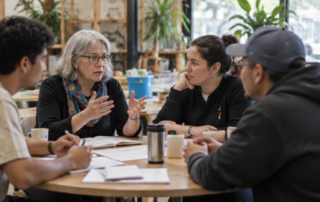 Members of an incorporated society meeting around a table to discuss plans and financial information